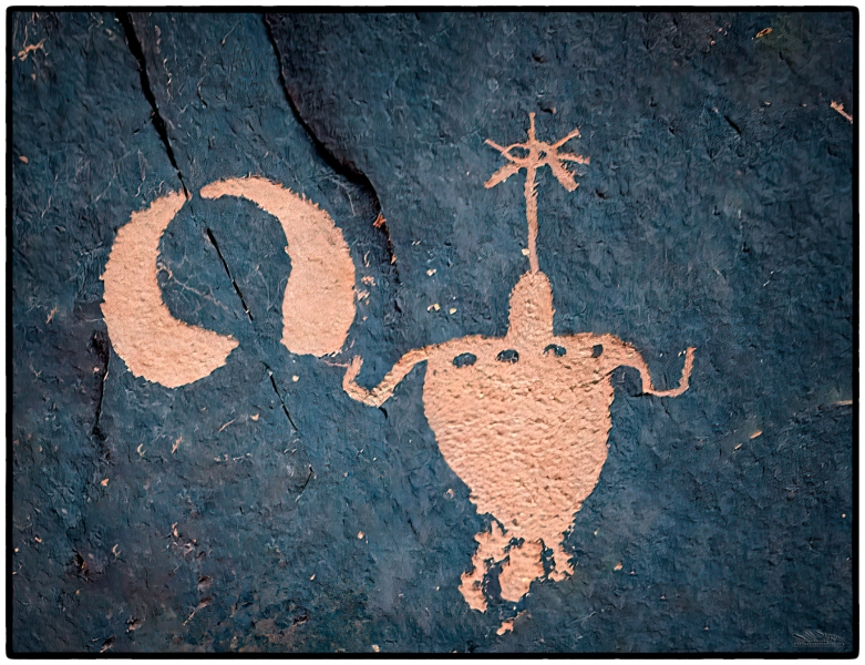 \"Calling All Ancient Alien Conspiracy Enthusiasts!\"  Back in the day, they must have had some wild hats and tunics because you can\'t look at some rock art without a sense of wonder.  This is one of the dozens of petroglyphs that adorn \'Newspaper Rock\' near Canyonlands NP.