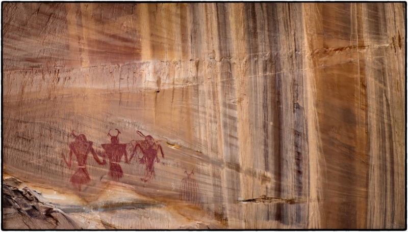 \"Ancient Guardians\" These Fremont pictographs are massive and dramatic.  They patiently tower over the stream that flows away from Calf Creek Falls as they have done for millennia.  Its interesting to note that the 3rd figure from the right apparently overpainted a smaller portrait.