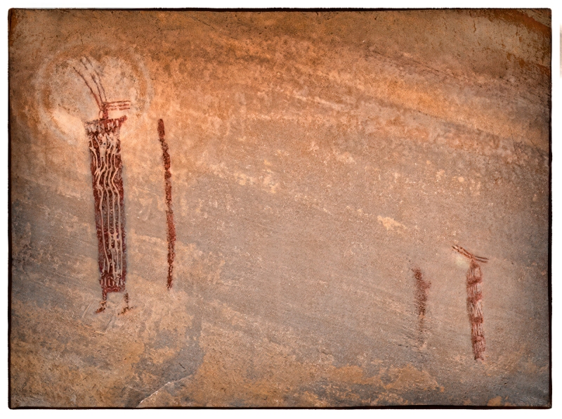 These figures are in an alcove high up on a cliff face and significantly faded.  D-Stretch restored many of the lost details as well as the sun-like symbol behind the head of the figure on the far left..  The elaborate headresses on enlongated bodies are striking. Old Woman Wash, Utah